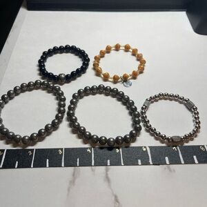 Set of Beaded Bracelets in Black, Gold, and Silver